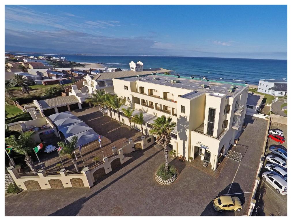 an aerial view of a building near the ocean at Seashells Holiday Apartments and Conference Centre in Jeffreys Bay