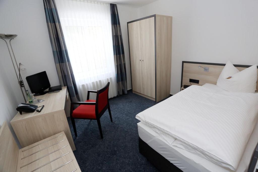 Postel nebo postele na pokoji v ubytování Hotel 7 Säulen GmbH