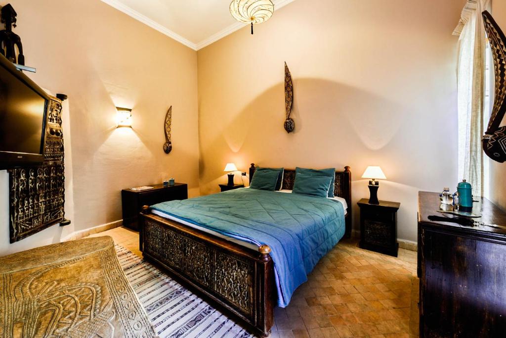 Postel nebo postele na pokoji v ubytování Riad les Ammonites and Spa