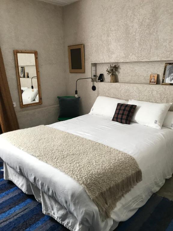 Postel nebo postele na pokoji v ubytování Kook Hotel Tarifa