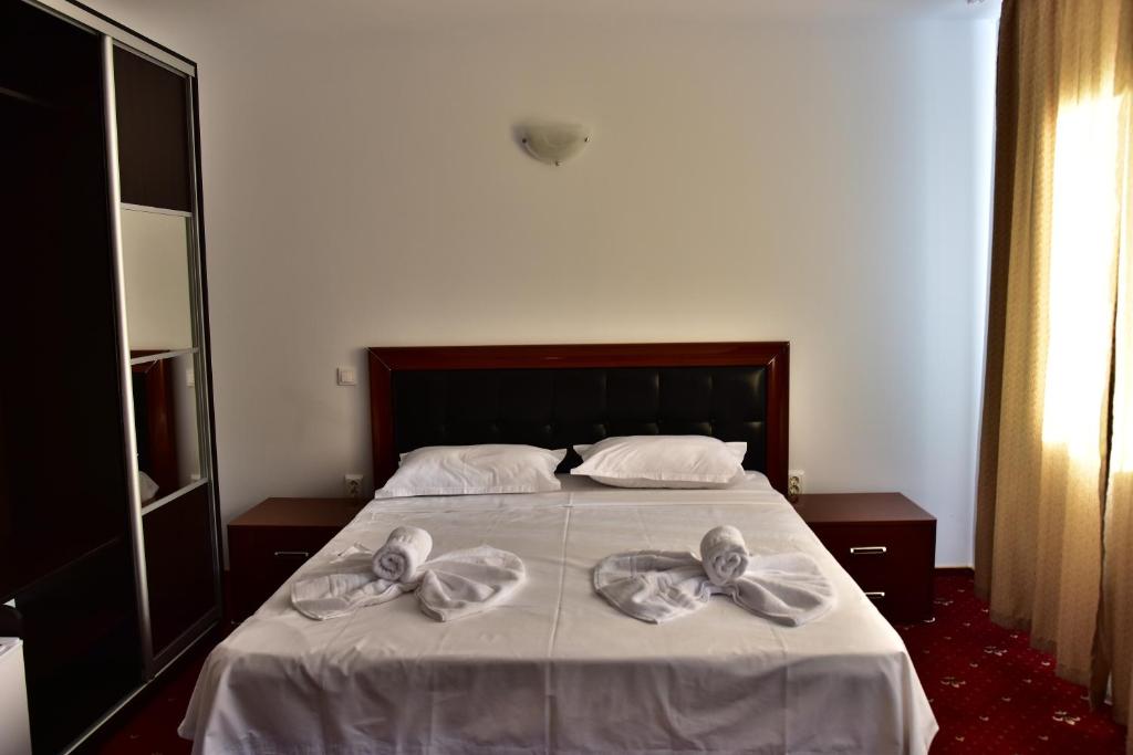 Postel nebo postele na pokoji v ubytování Hotel Ostrov
