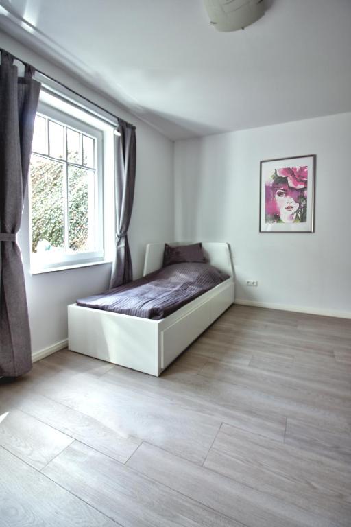 Postel nebo postele na pokoji v ubytování Haus Carolin Dangast
