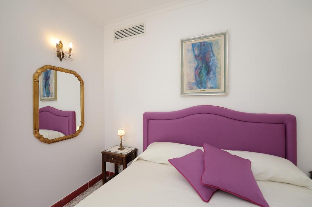 Postel nebo postele na pokoji v ubytování Residenza Luce