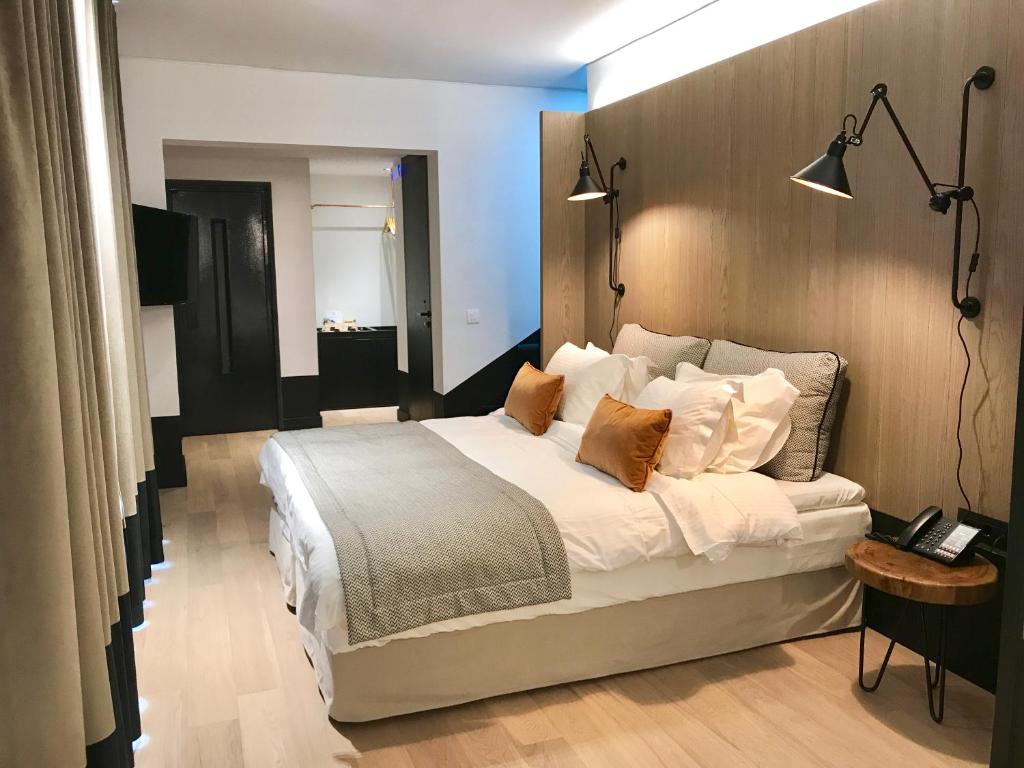 Postel nebo postele na pokoji v ubytování Niki Athens Hotel