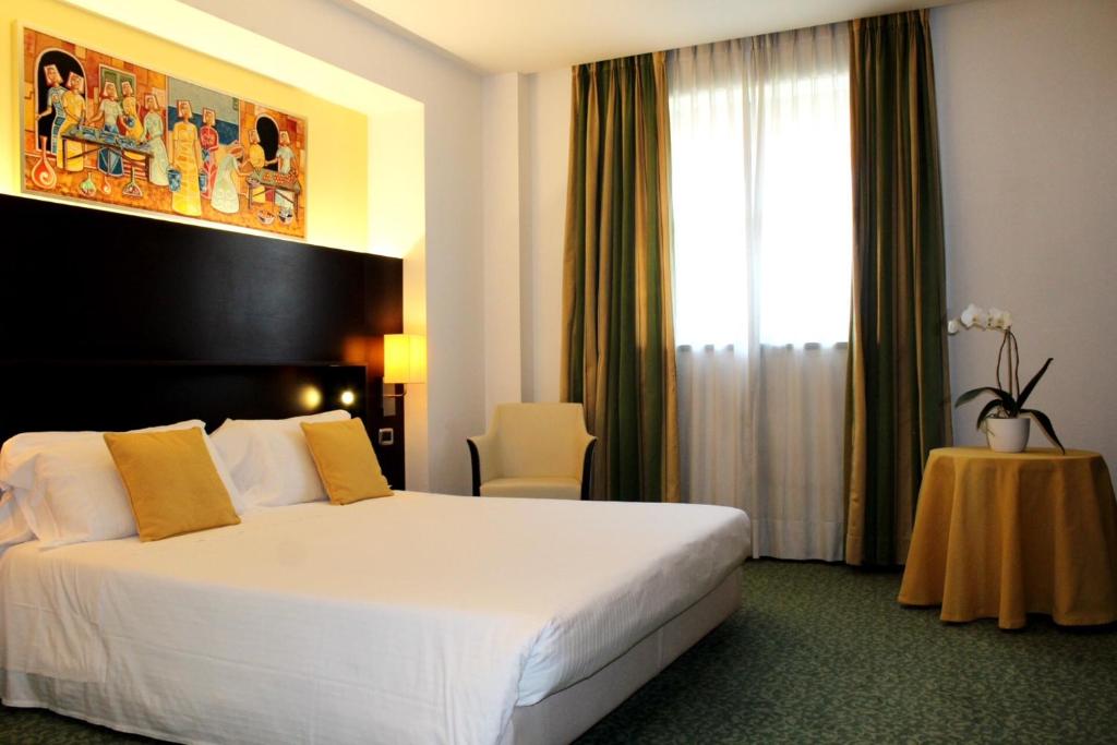 Postel nebo postele na pokoji v ubytování Hotel Senator