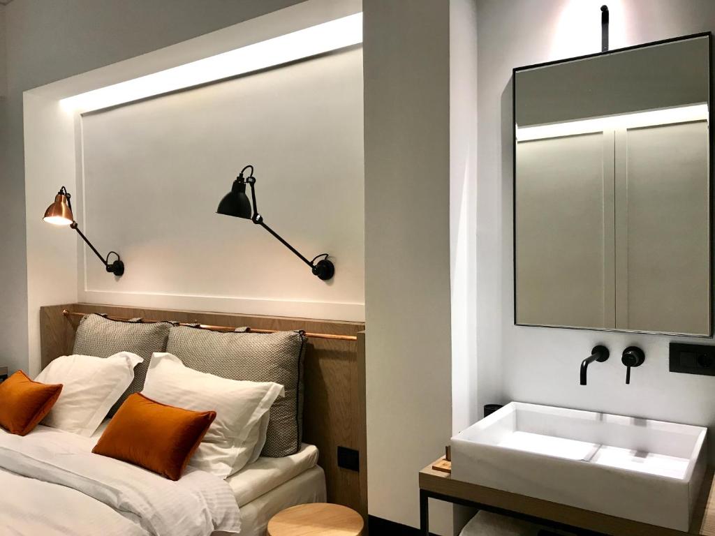 Postel nebo postele na pokoji v ubytování Niki Athens Hotel