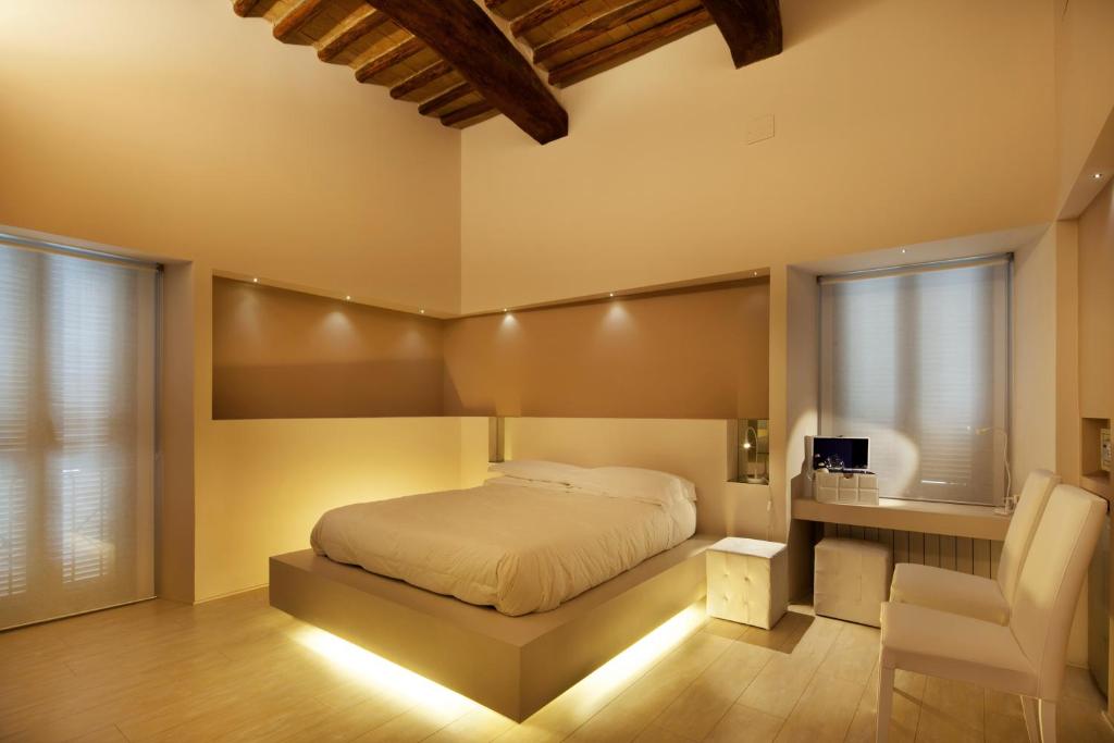 Posteľ alebo postele v izbe v ubytovaní Hotel Degli Affreschi
