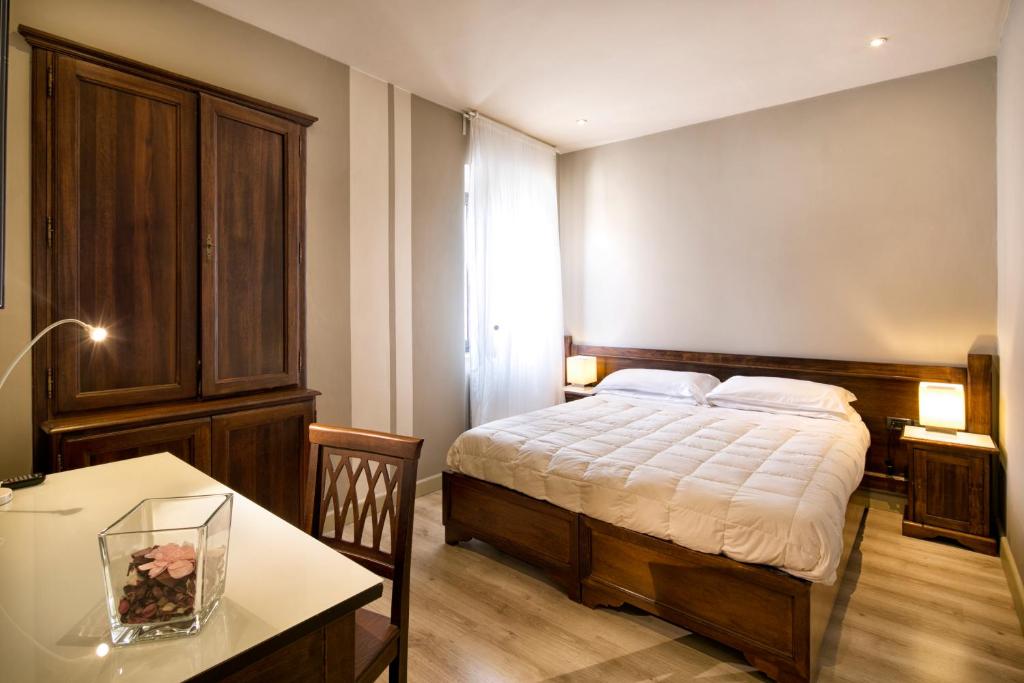Posteľ alebo postele v izbe v ubytovaní Hotel Degli Affreschi