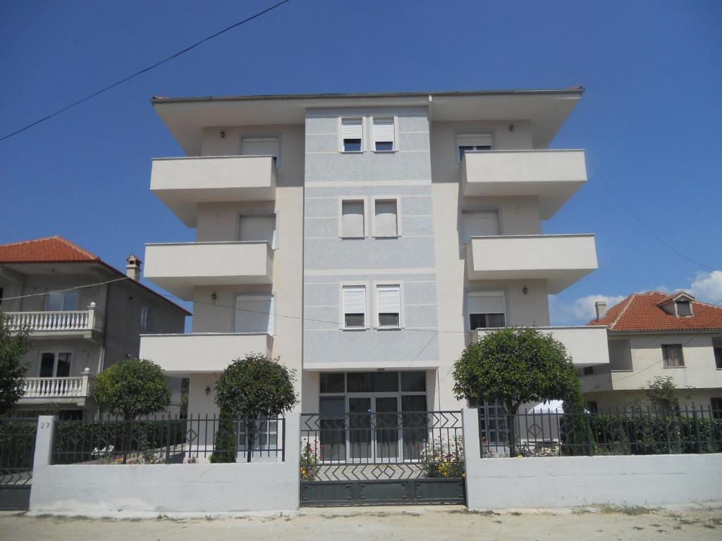 a white building with trees in front of it at Villa Braho 1 in Pogradec