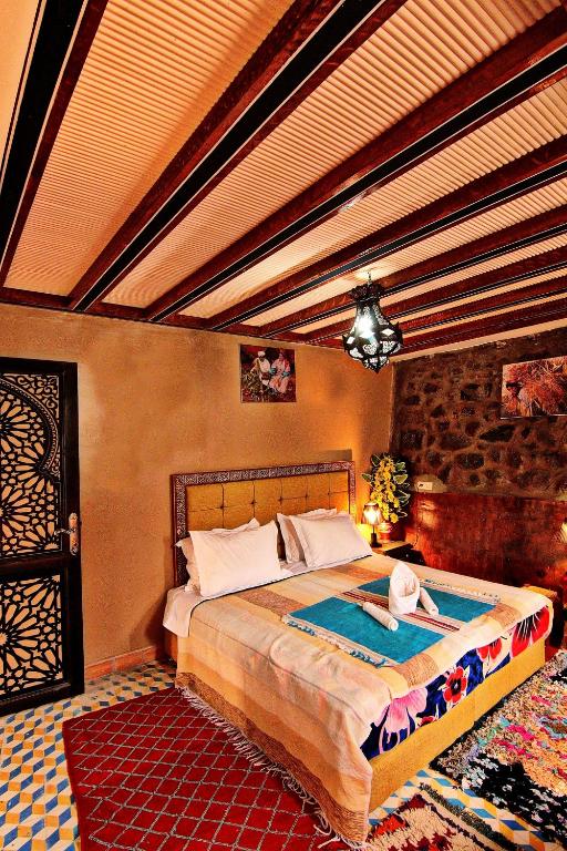 a bedroom with a large bed in a room at Toubkal Garden in Imlil