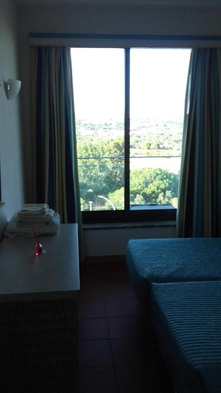 Postel nebo postele na pokoji v ubytování Residence Golf Club, Vilamoura