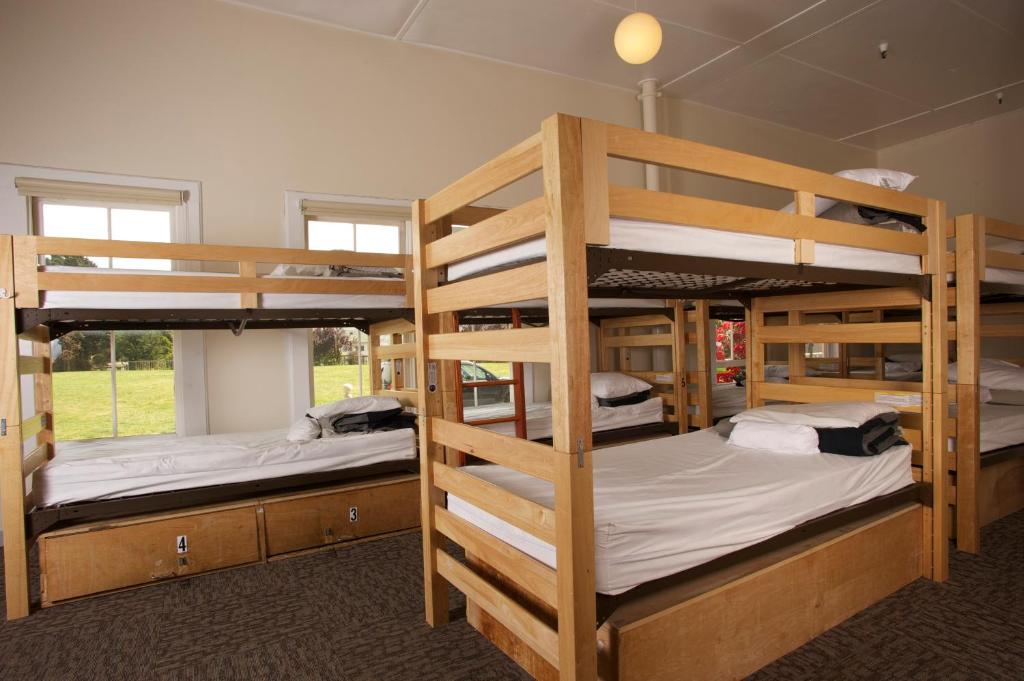 a room with three bunk beds in a house at HI San Francisco Fisherman's Wharf Hostel in San Francisco
