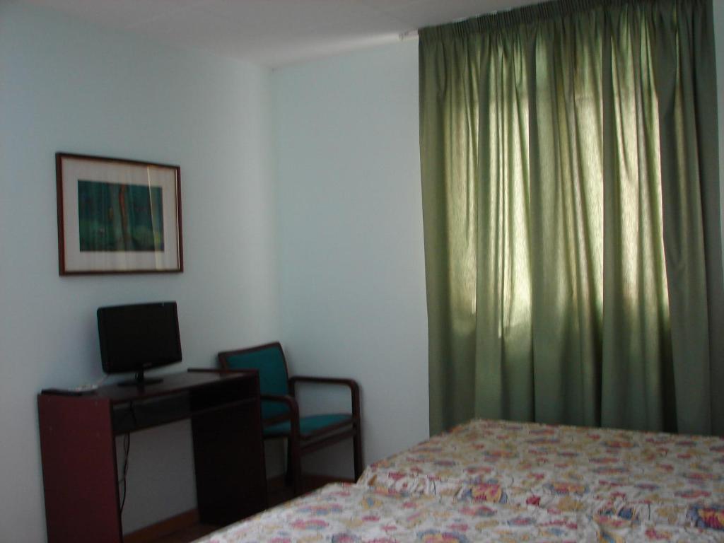 Postel nebo postele na pokoji v ubytování Hostal Del Ripollès