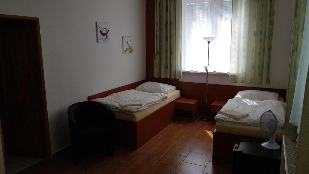 Postel nebo postele na pokoji v ubytování Penzion PKO Nitra