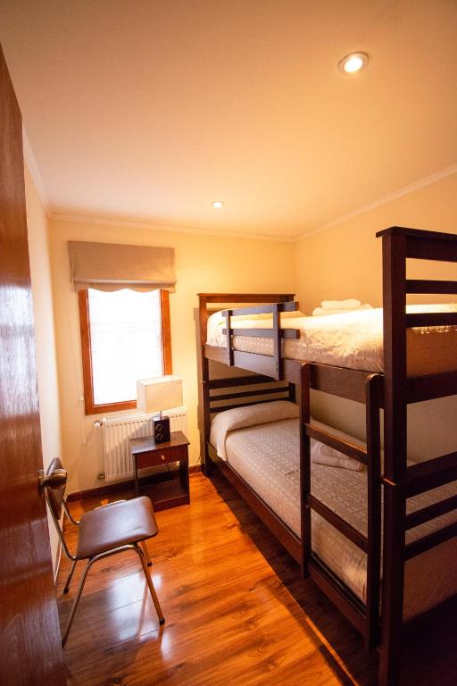 Postel nebo postele na pokoji v ubytování Departamentos Costanera