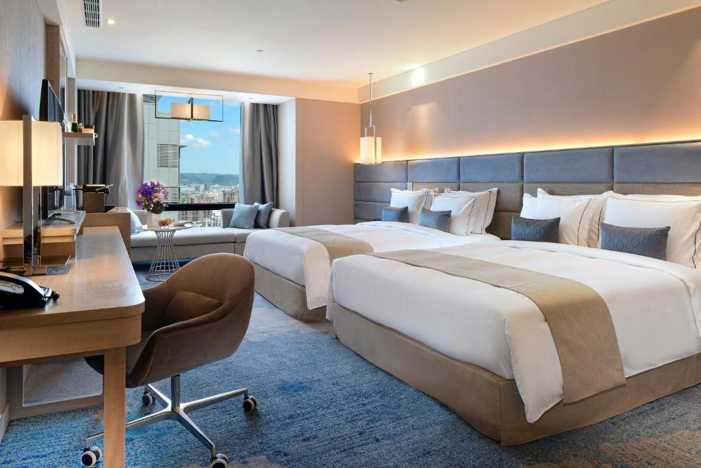 Postel nebo postele na pokoji v ubytování Caesar Park Hotel Banqiao