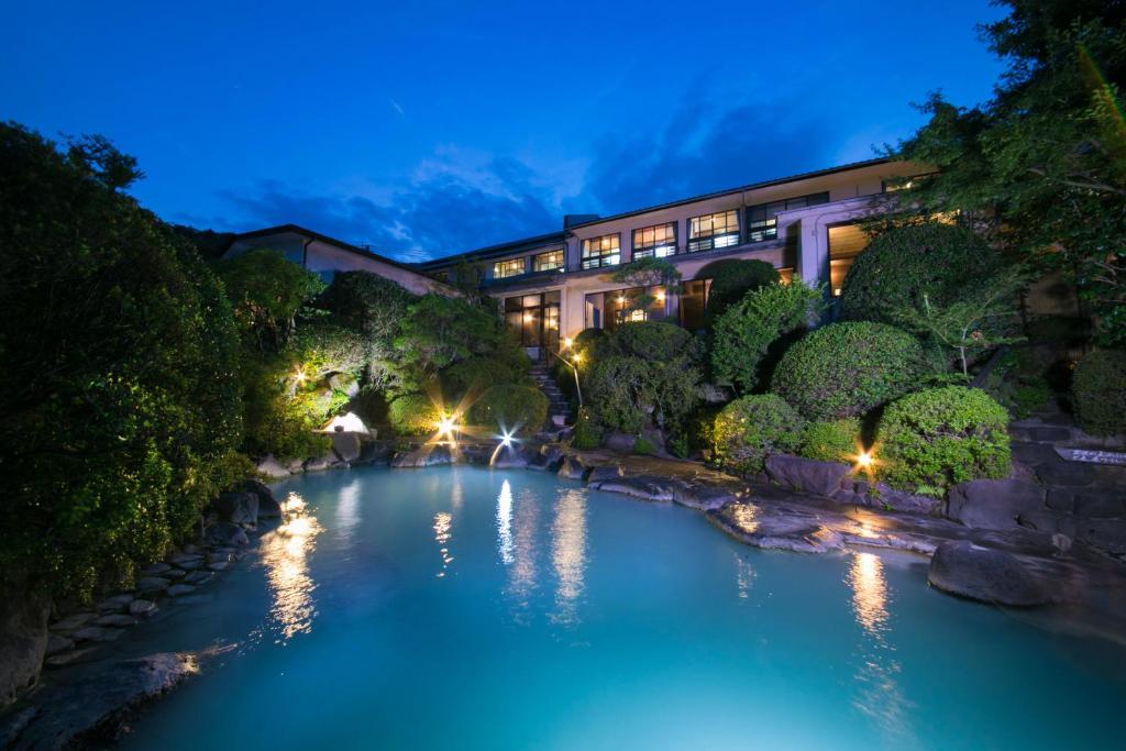 a pool of water in front of a building at Okamotoya in Beppu