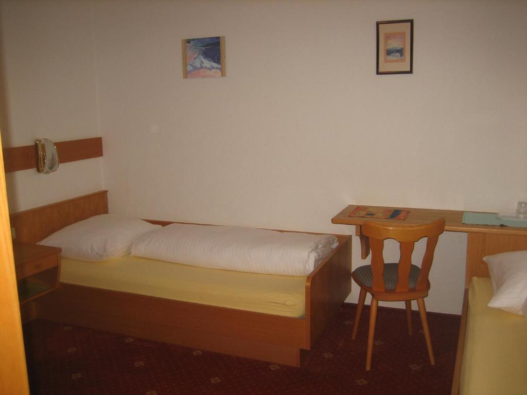 Postel nebo postele na pokoji v ubytování Ad-Capellam