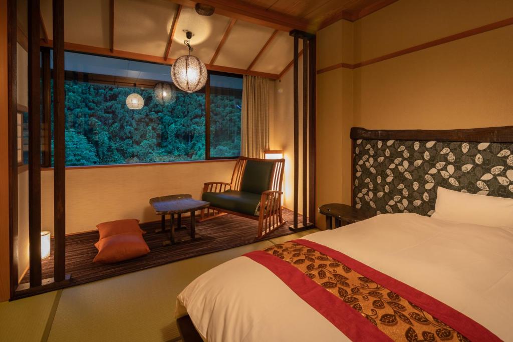 Postel nebo postele na pokoji v ubytování Ryokan Gizan