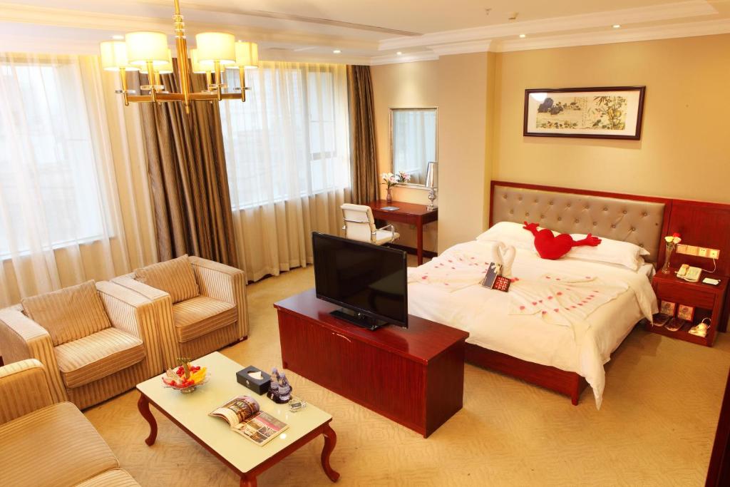 Postel nebo postele na pokoji v ubytování Guangzhou Shi Liu Hotel