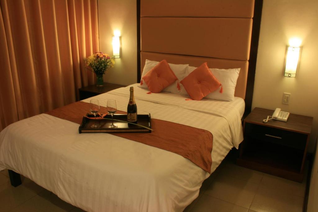 Postel nebo postele na pokoji v ubytování O Hotel