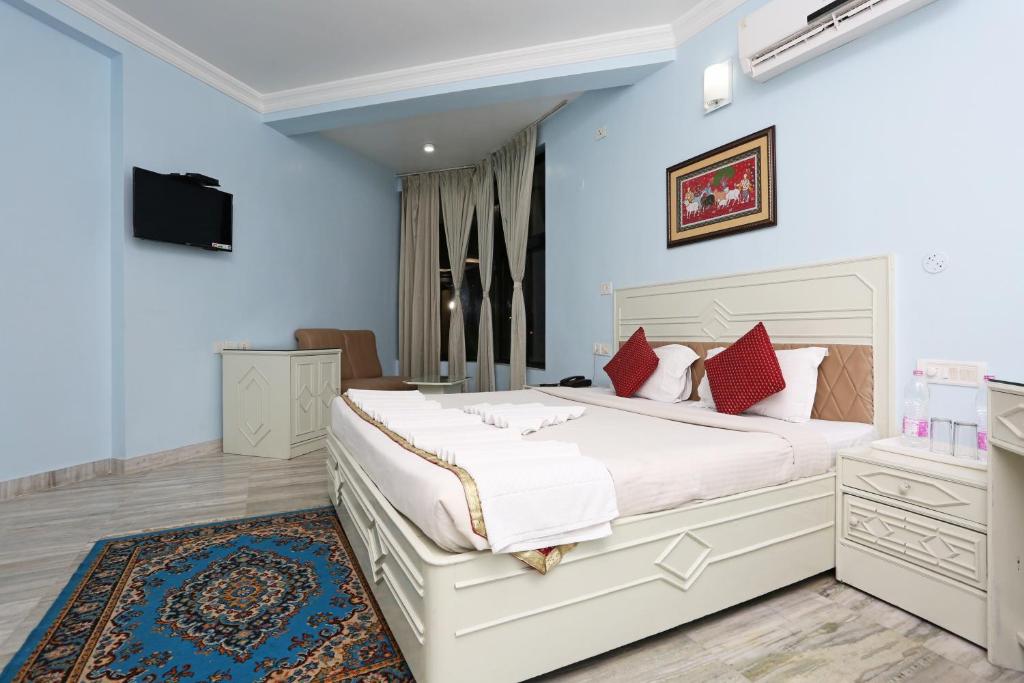 Postel nebo postele na pokoji v ubytování Hotel Niladri