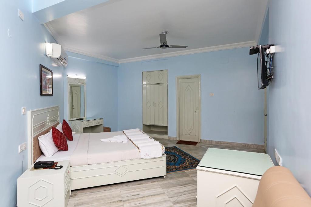 Postel nebo postele na pokoji v ubytování Hotel Niladri