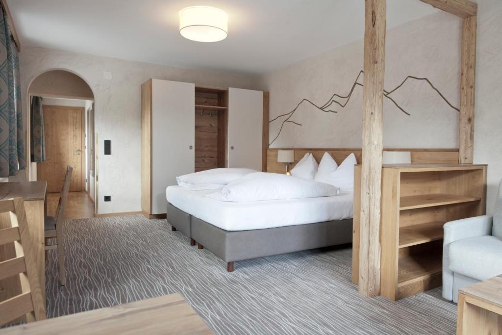 Postel nebo postele na pokoji v ubytování Hotel Mozart