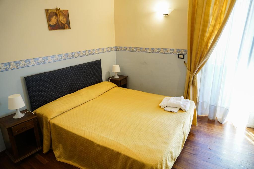 Łóżko lub łóżka w pokoju w obiekcie Stesicorea Palace
