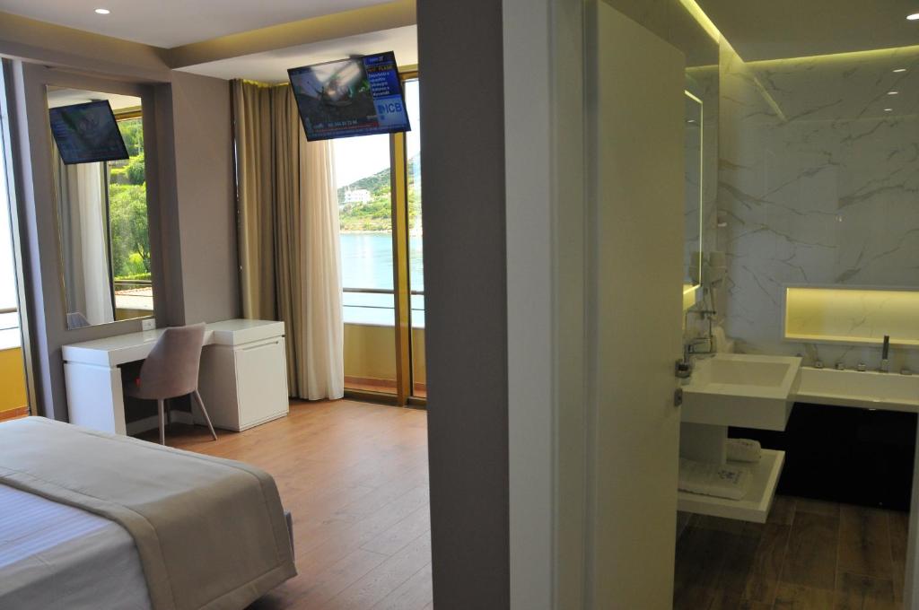 Postel nebo postele na pokoji v ubytování Paradise Beach Hotel