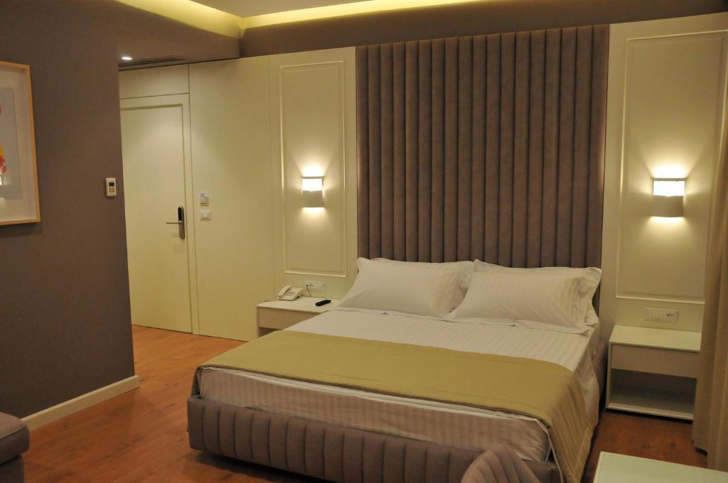 Postel nebo postele na pokoji v ubytování Paradise Beach Hotel