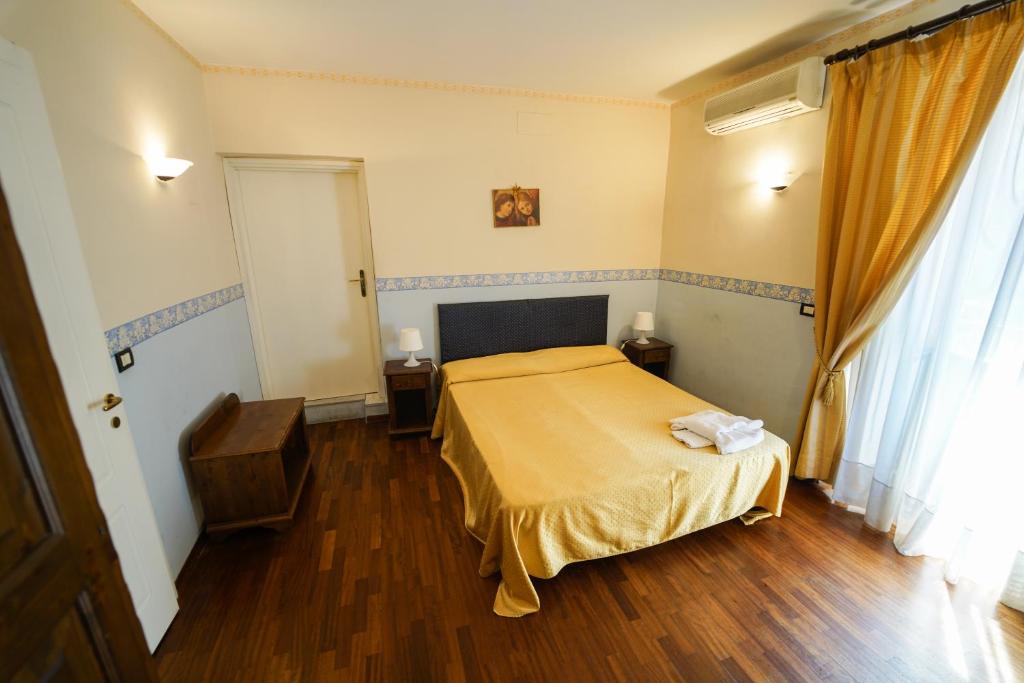 Łóżko lub łóżka w pokoju w obiekcie Stesicorea Palace
