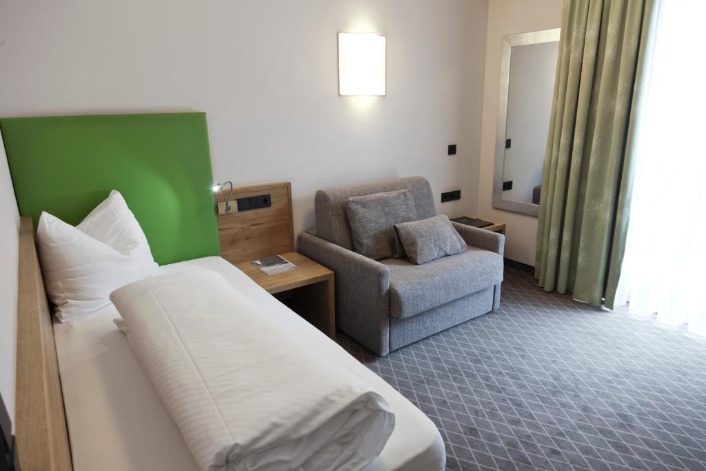 Postel nebo postele na pokoji v ubytování Hotel Mozart