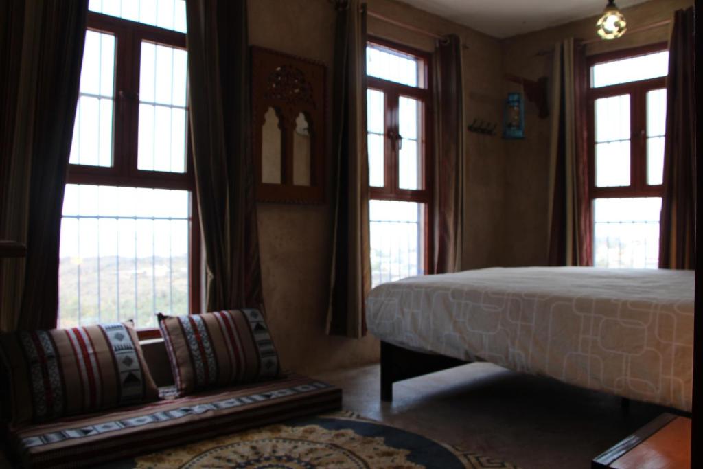 Postel nebo postele na pokoji v ubytování Durrat Al-Misfah Guest House