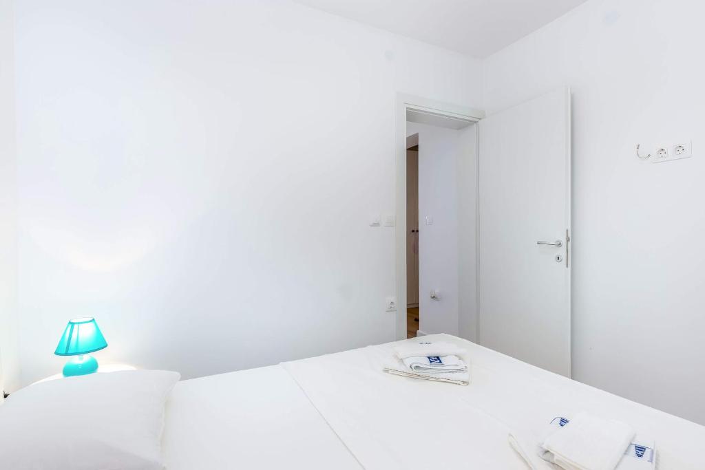Postel nebo postele na pokoji v ubytování Apartments Selce