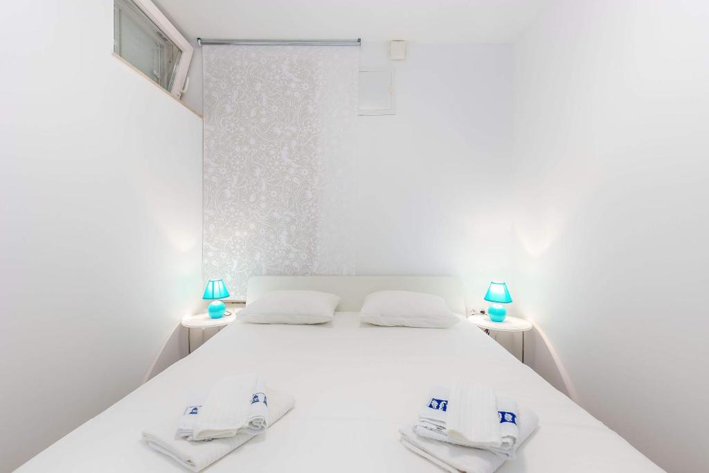 Postel nebo postele na pokoji v ubytování Apartments Selce