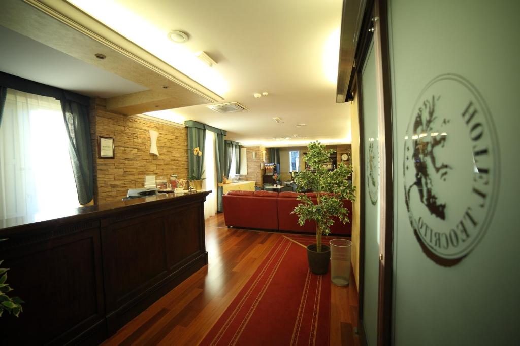 Postel nebo postele na pokoji v ubytování Hotel Teocrito