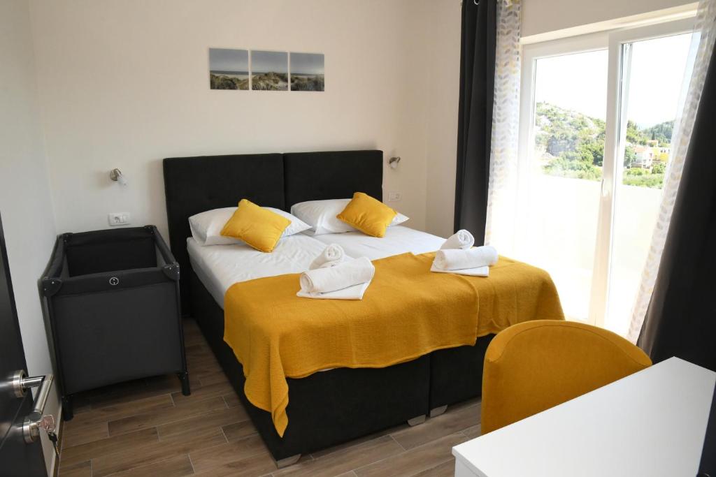 Postel nebo postele na pokoji v ubytování Sagena Rooms