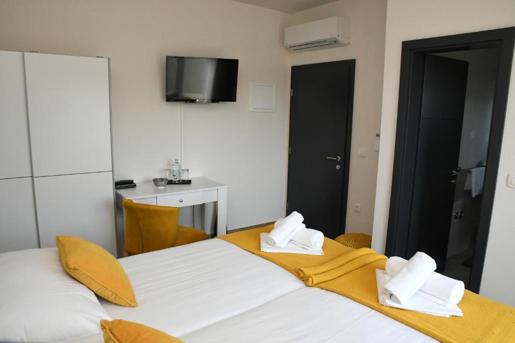 Postel nebo postele na pokoji v ubytování Sagena Rooms