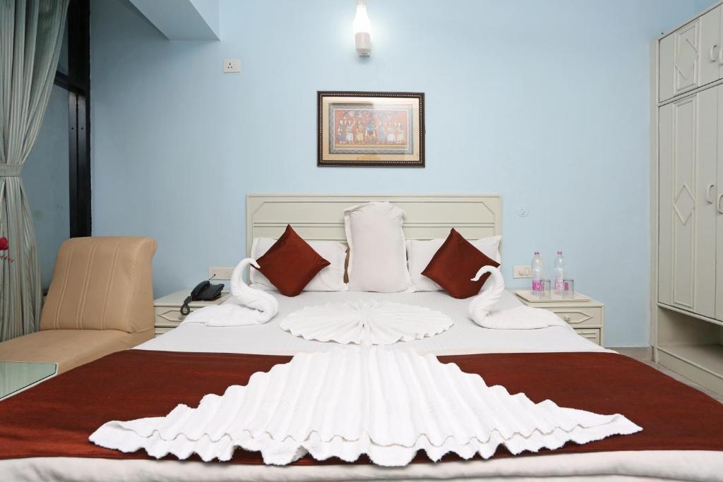 Postel nebo postele na pokoji v ubytování Hotel Niladri