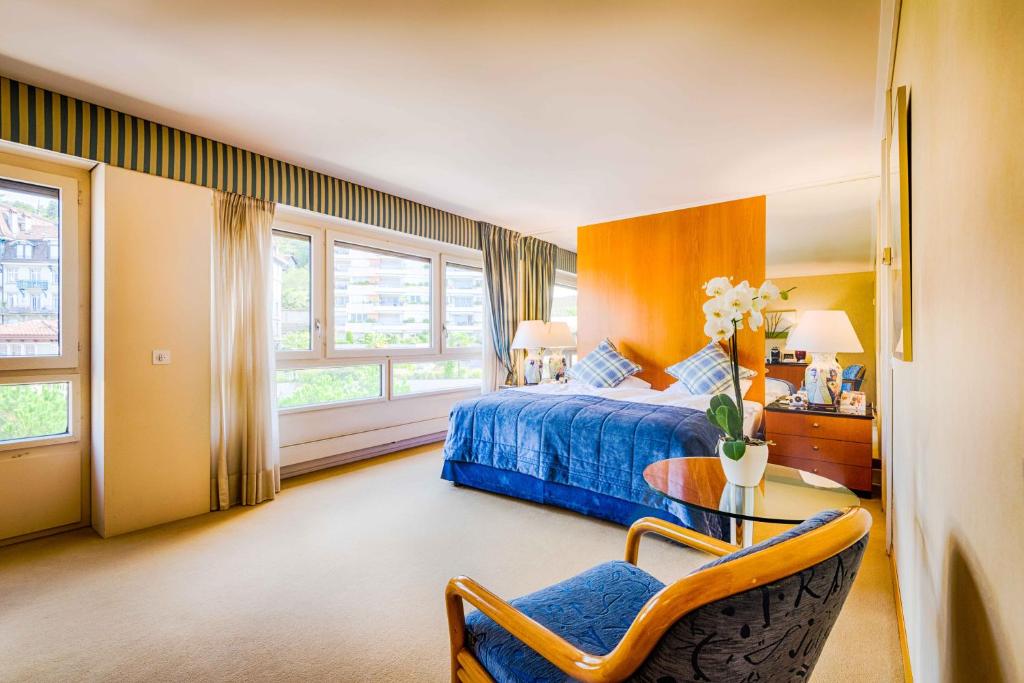 Postel nebo postele na pokoji v ubytování Royal Plaza Montreux