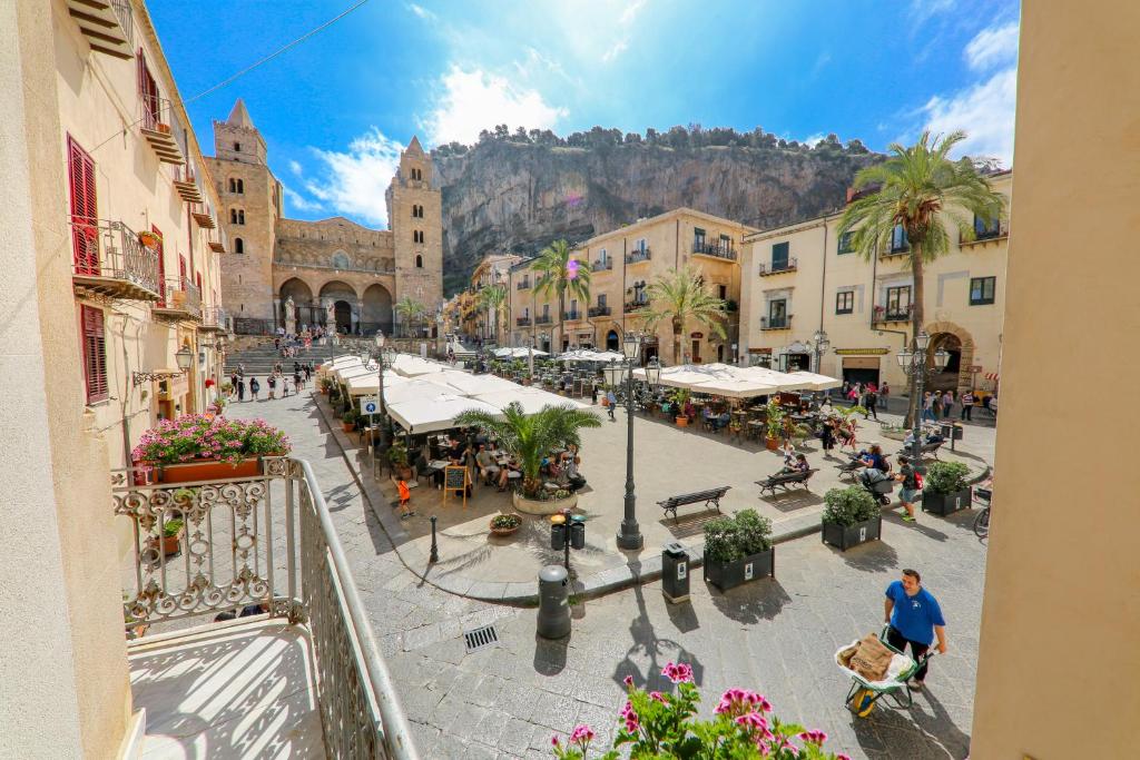 a view of a town with a mountain in the background at Madonie Holidays in Cefalù