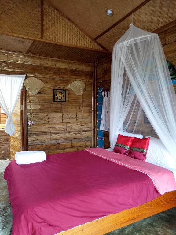 Postel nebo postele na pokoji v ubytování Tulip Resort Pai
