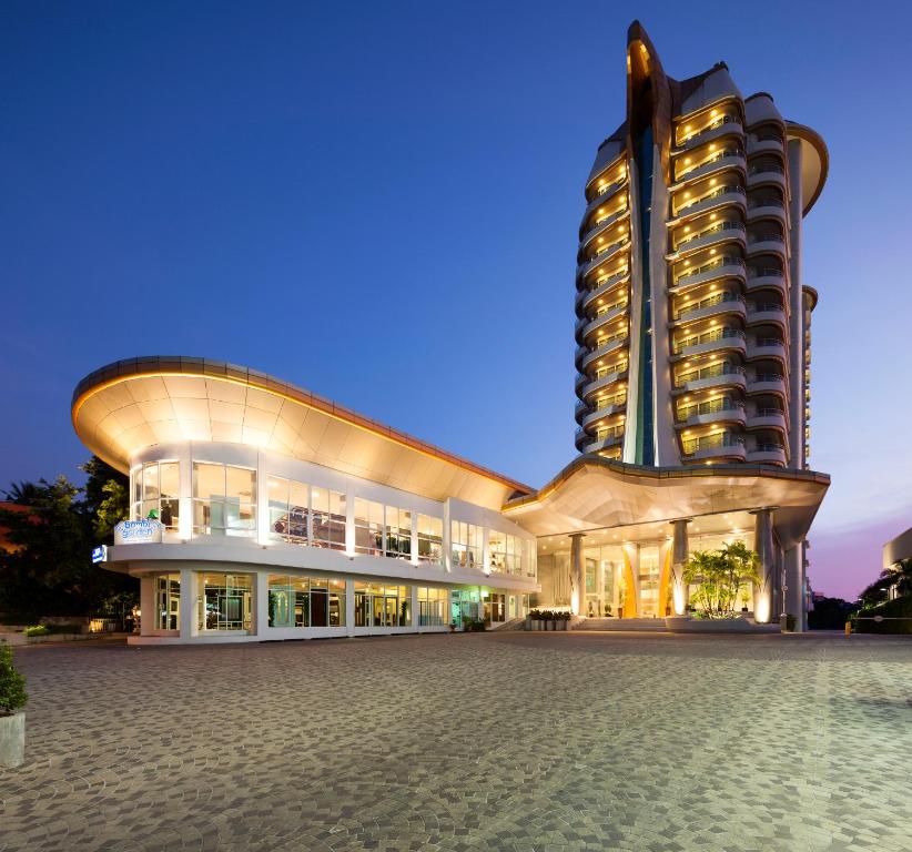 a large building next to a tall building at Viva Garden Serviced Residence in Bangkok