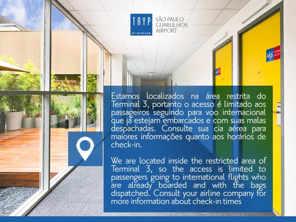a sign is posted outside of a building at TRYP BY WYNDHAM São Paulo Airport - Hotel de Transito Terminal 3 -Lado Ar - Área restrita á passageiros já embarcados - Piso 1 in Guarulhos