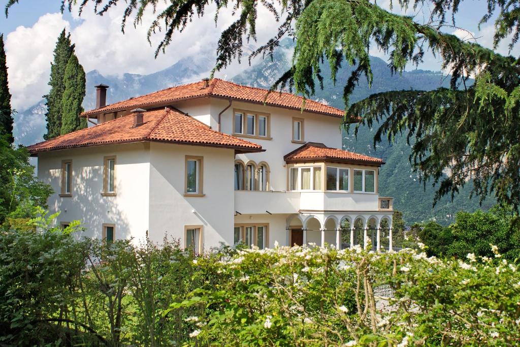 a large white building with a red roof at Trento nel verde in Trento