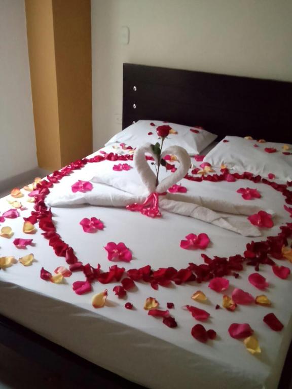 Postel nebo postele na pokoji v ubytování Hotel Portal Dorado