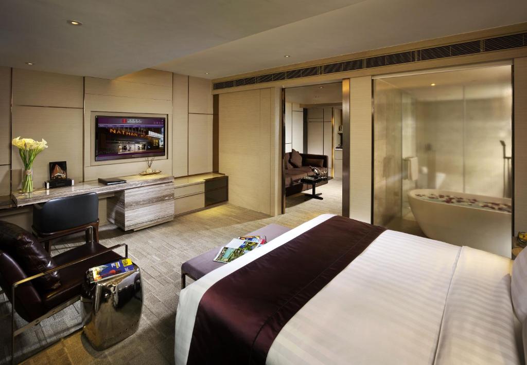 Postel nebo postele na pokoji v ubytování Nathan Hotel
