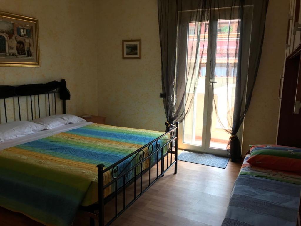 Posteľ alebo postele v izbe v ubytovaní Mirella's House ViaVerona