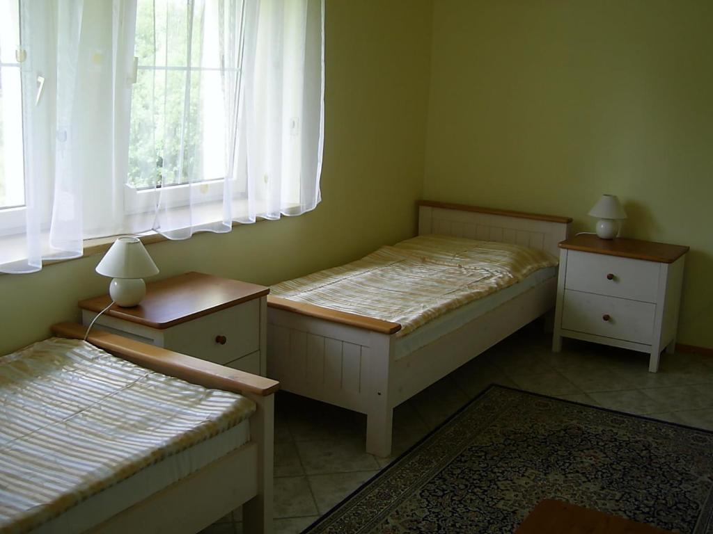 Postel nebo postele na pokoji v ubytování Penzion Rozalie